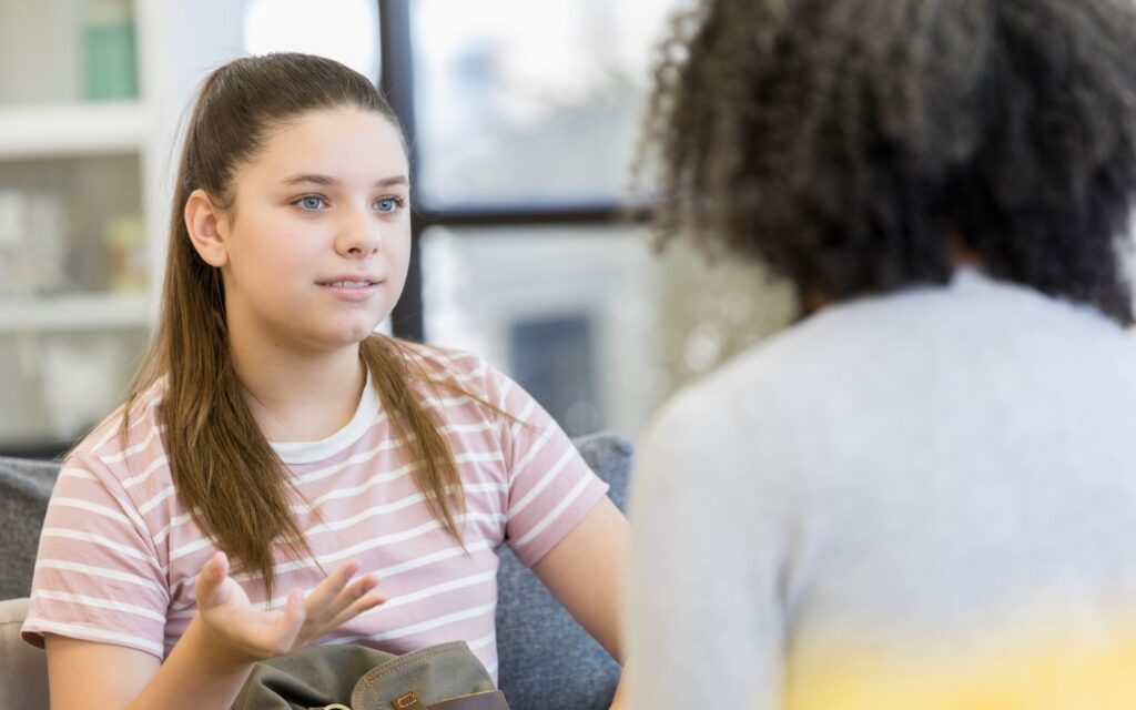 Young person talking with a mentor