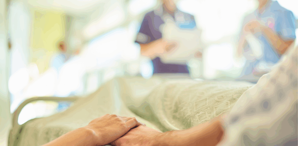 close up of person lying in a hospital bed
