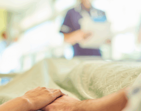 close up of person lying in a hospital bed